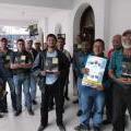 Community members in San Rafael Las Flores pose with copies of AI's report on mining in Guatemala. September 2014