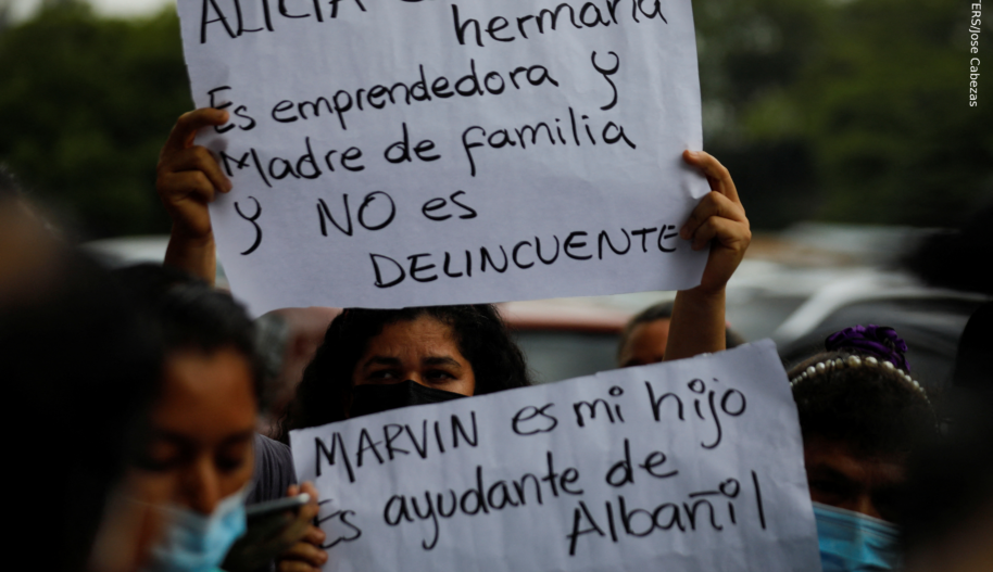 Women hold signs at protest