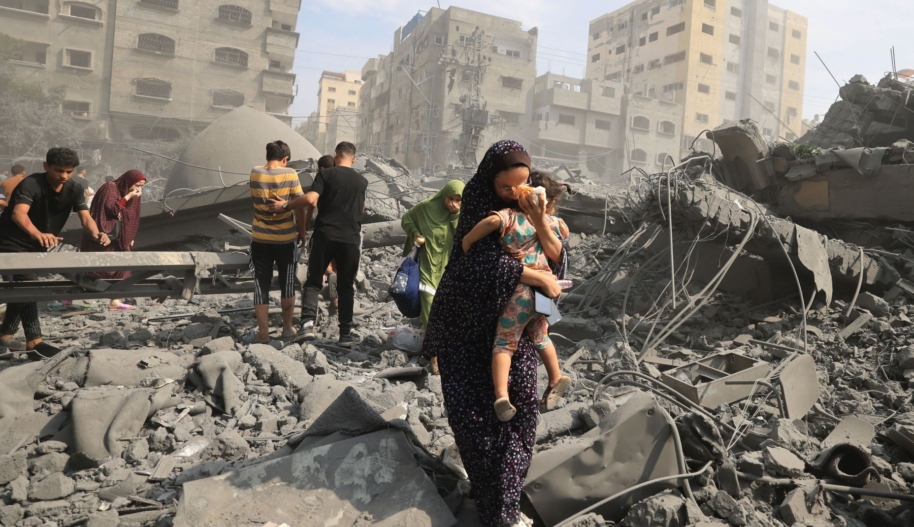 States must call for an immediate ceasefire at Paris Humanitarian Conference to ensure safe delivery of aid in Gaza' > Palestinians evacuate the area following an Israeli airstrike on the Sousi mosque in Gaza City on October 9, 2023. (Photo by MAHMUD HAMS/AFP via Getty Images)