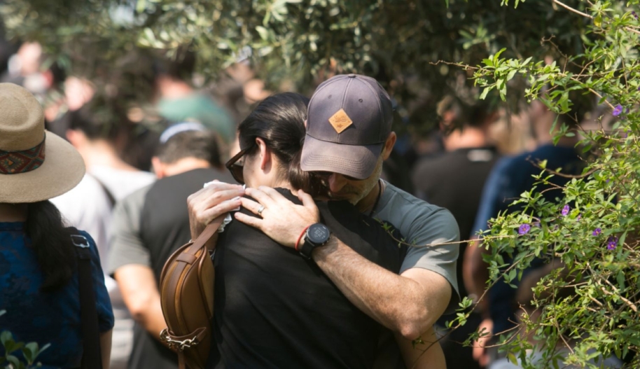 Family and friends of May Naim, 24, who was murdered by Palestinians militants at the "Supernova" festival, near the Israeli border with Gaza strip, react during her funeral on October 11, 2023 in Gan Haim, Israel. Israel has sealed off Gaza and conducted airstrikes on Palestinian territory after an attack by Hamas killed hundreds and took more than 200 hostages. © Amir Levy/Getty Images