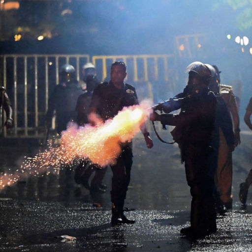Top image: policeman fires a tear gas canister to disperse protesters during the 50th day of anti-government protests demanding the resignation of Sri Lanka's President Gotabaya Rajapaksa over the country's crippling economic crisis, in Colombo on May 28, 2022. Photo by ISHARA S. KODIKARA/AFP via Getty Images.