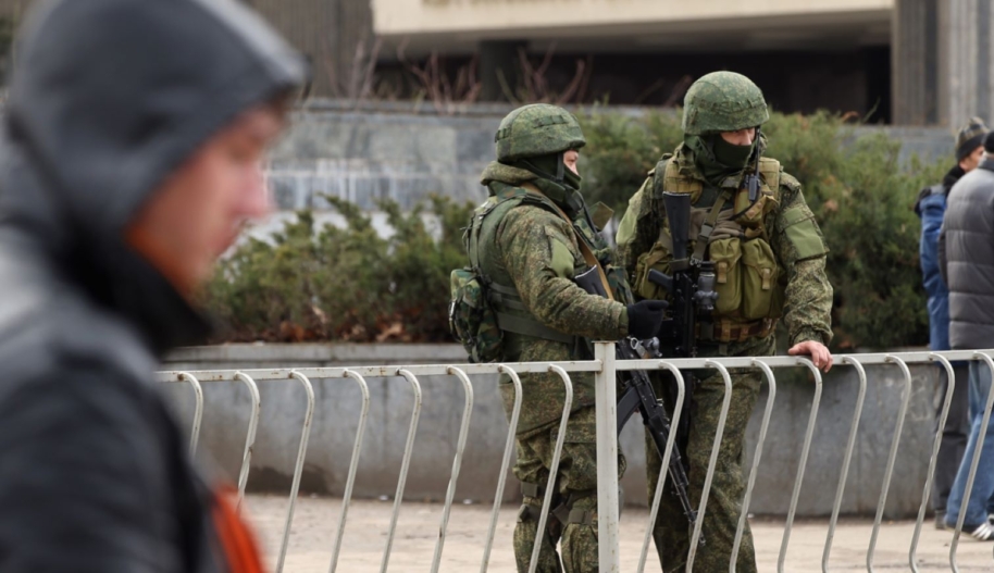 Heavily-armed soldiers without identifying insignia and pro-Russian militants guard the Crimean parliament building on March 1, 2014 in Simferopol, Ukraine. Photo by Sean Gallup/Getty Images,