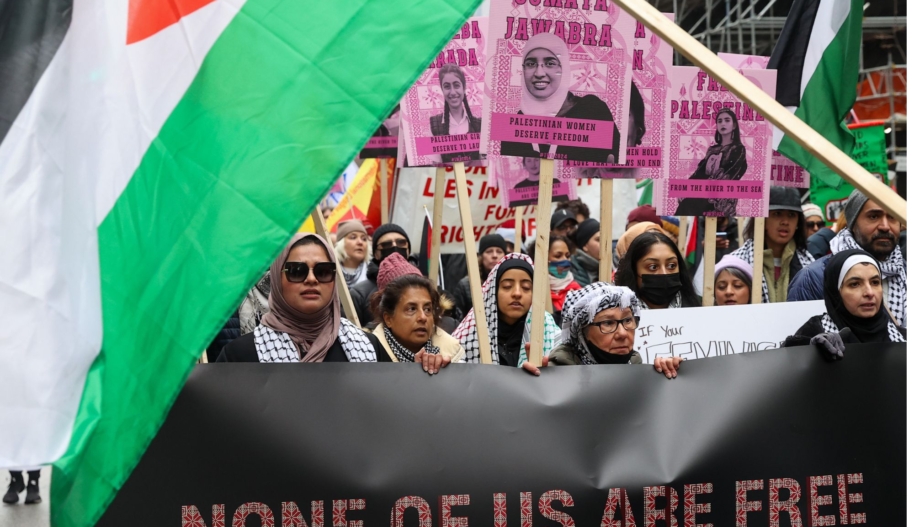 People holding Palestinian flags and portraits of Palestinian women attend Toronto's annual International Women's Day (IWD) march on March 2, 2024 in Ontario, Canada. (Photo by Mert Alper Dervis/Anadolu via Getty Images)