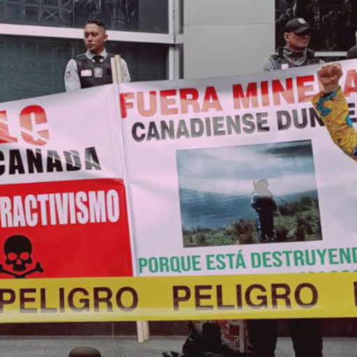 Danger reads the yellow tape during a protest outside Canada’s Embassy in Quito on March 4. Free Trade Agreement with Canada = More extractivism. Canadian mining out, reads the banner. Photo: Acción Ecológica @AcEcologic